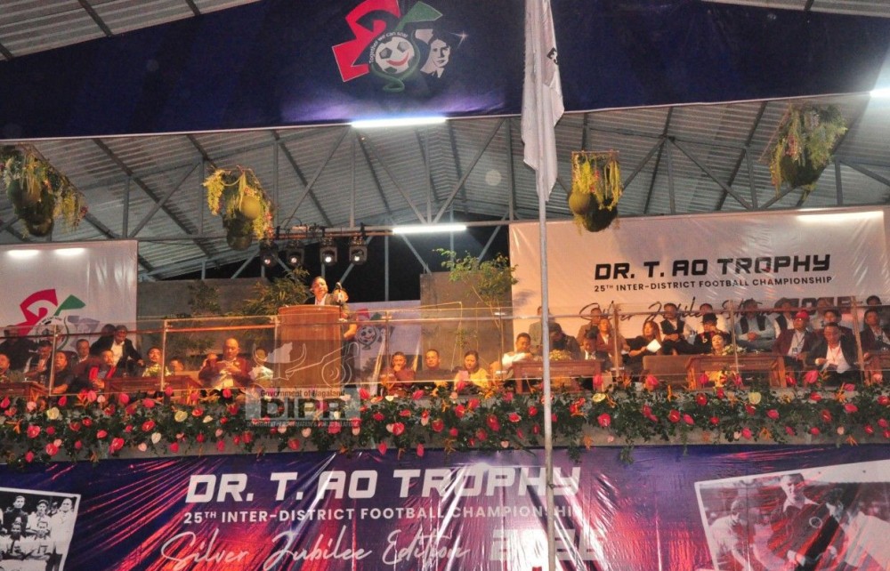 Minister for Housing and Mechanical Engineering Bashangmongba Chang addresses the gathering during the inaugural programme of the 25th Dr T Ao Trophy at the Renpo Lu Sports Complex, Ungma, Mokokchung, on October 13. (DIPR File Photo)